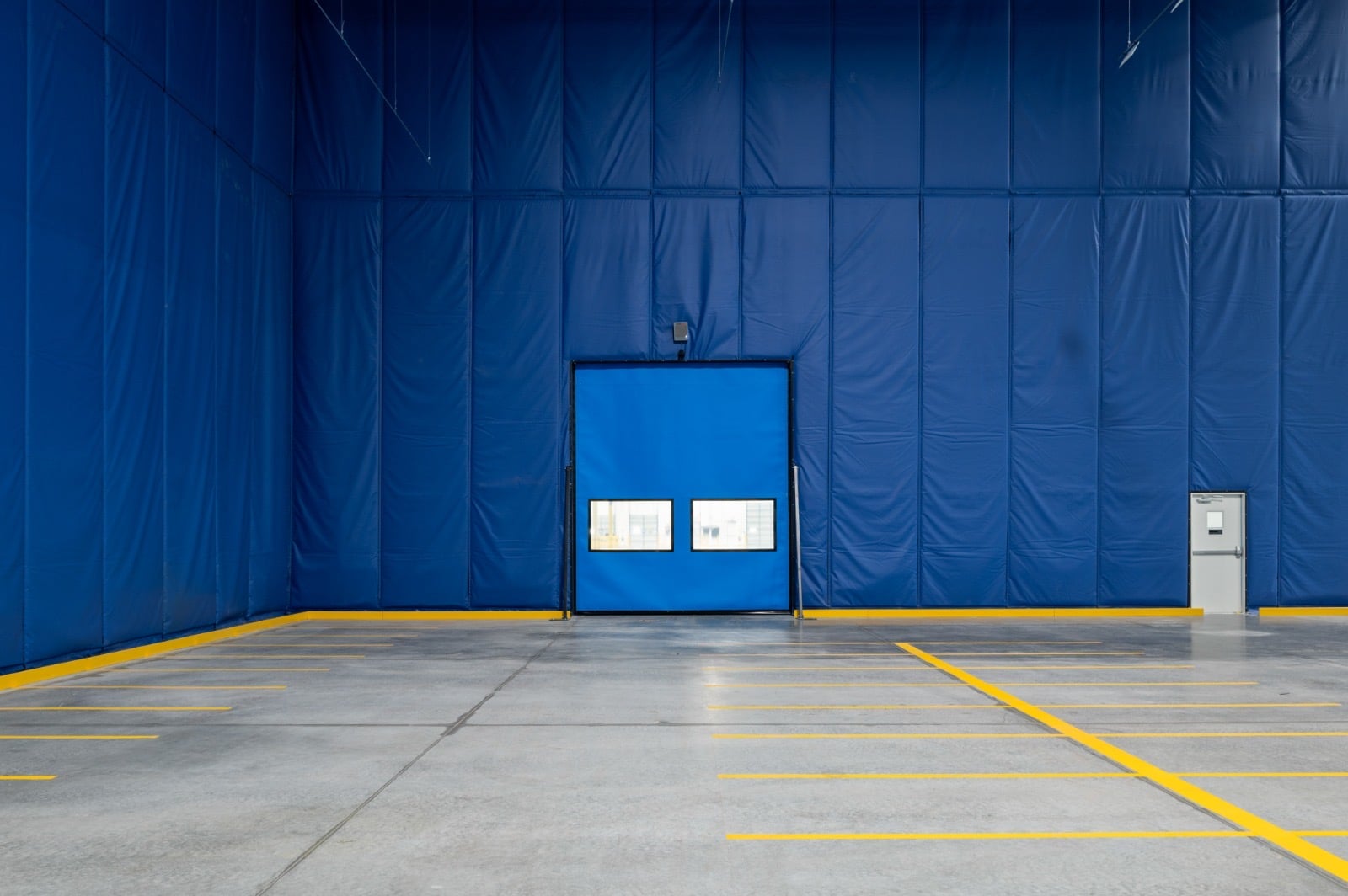 Enclosure wall and door with floor striping