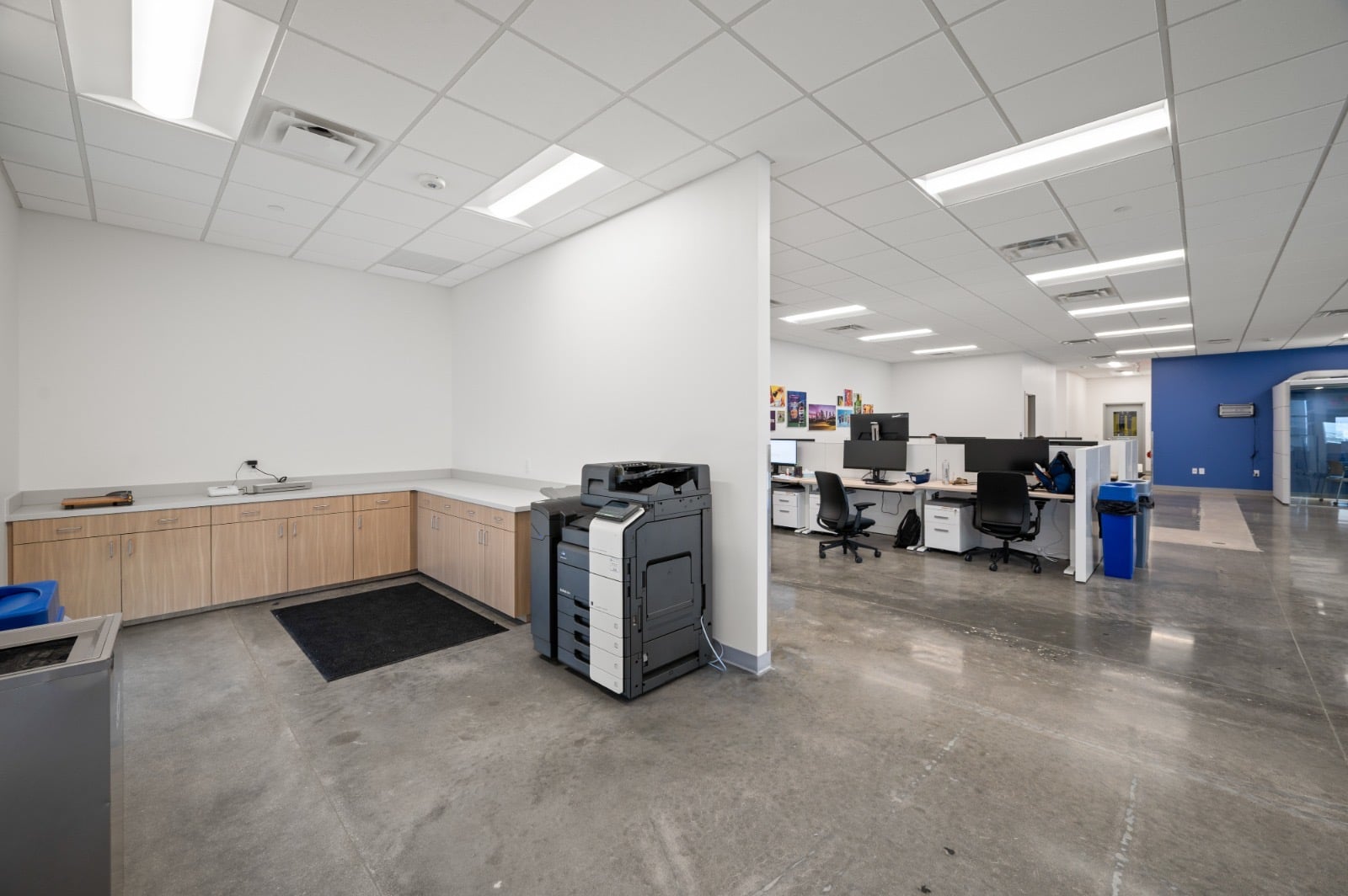 Office workroom and open office with polished concrete