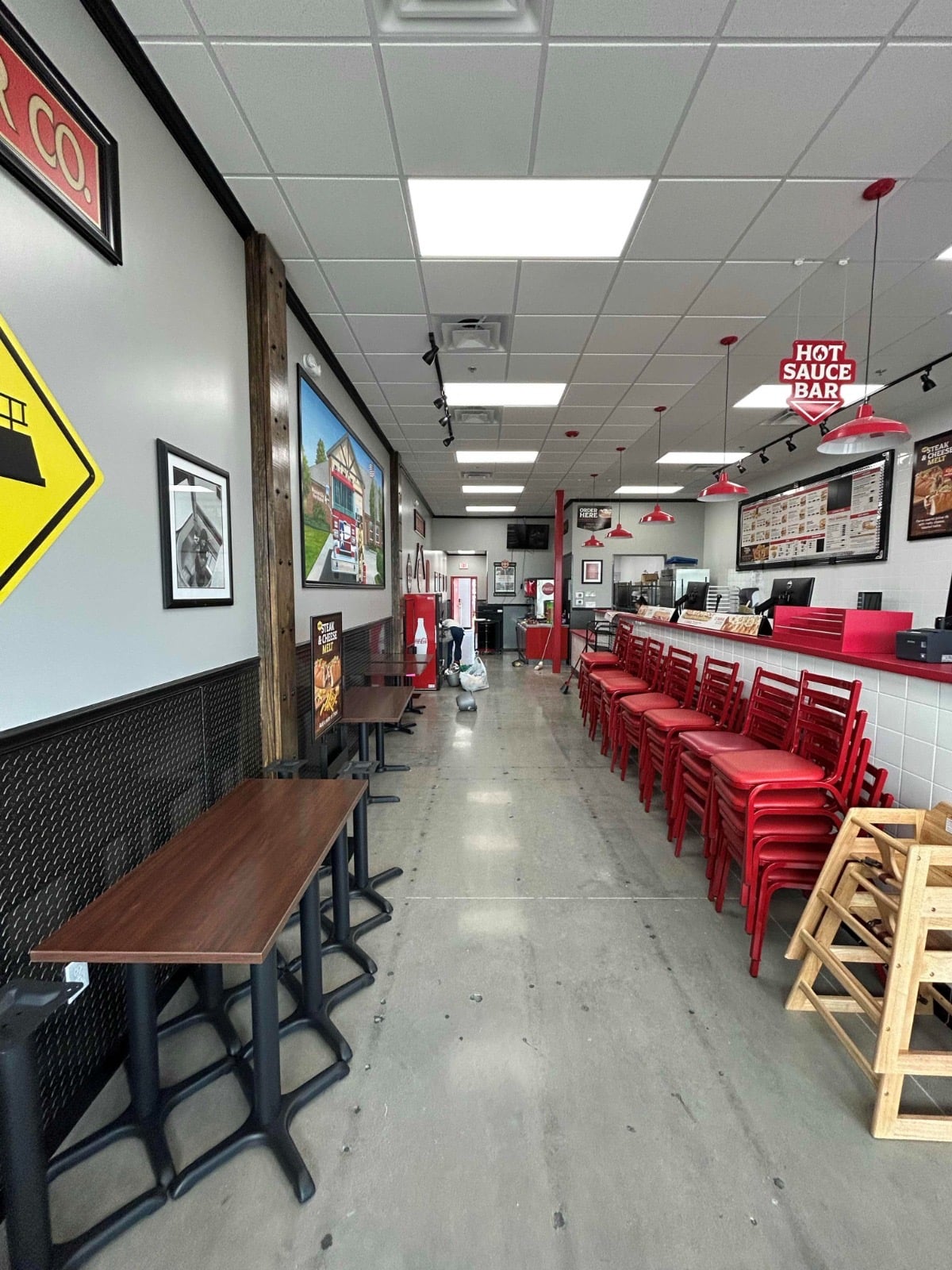 Quick-service restaurant dining room with sealed concrete floor